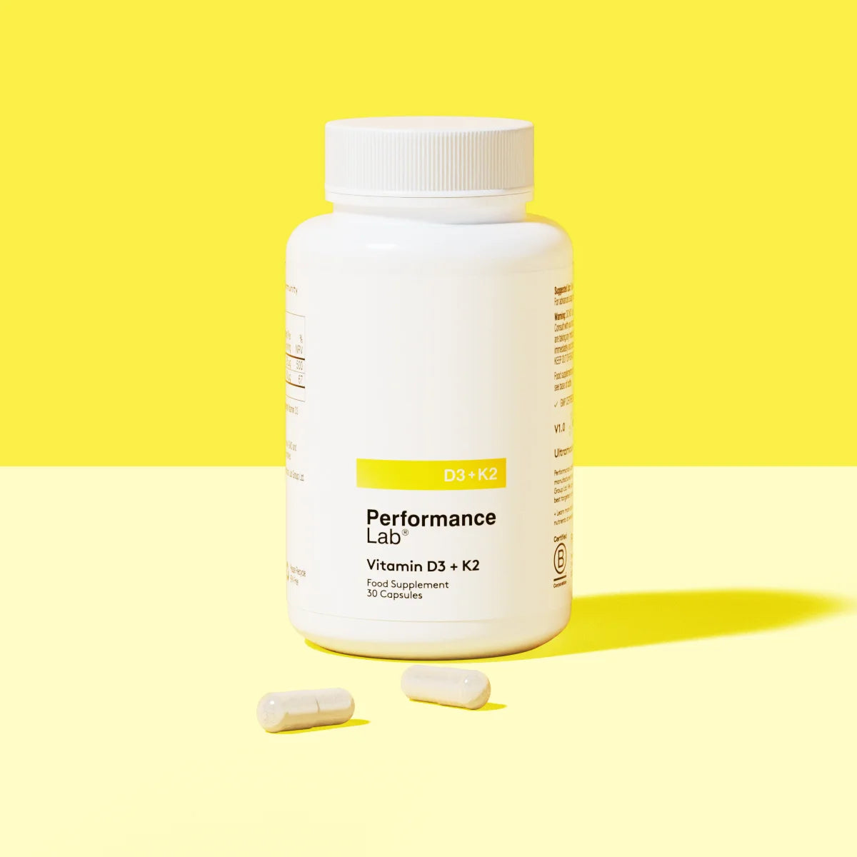 Performance Lab Vitamin D3 plus K2 supplement bottle with two capsules.