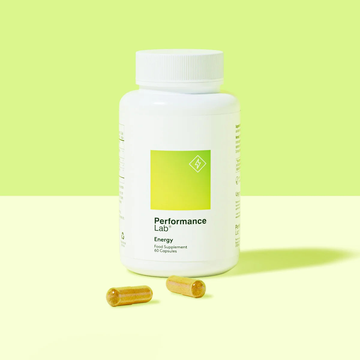 Performance Lab Energy supplement bottle with two capsules.