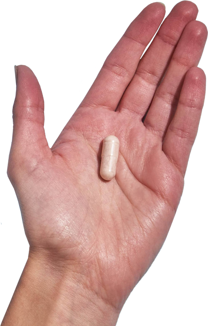 image of hand holding 1 Performance Lab® UK B-Complex capsule